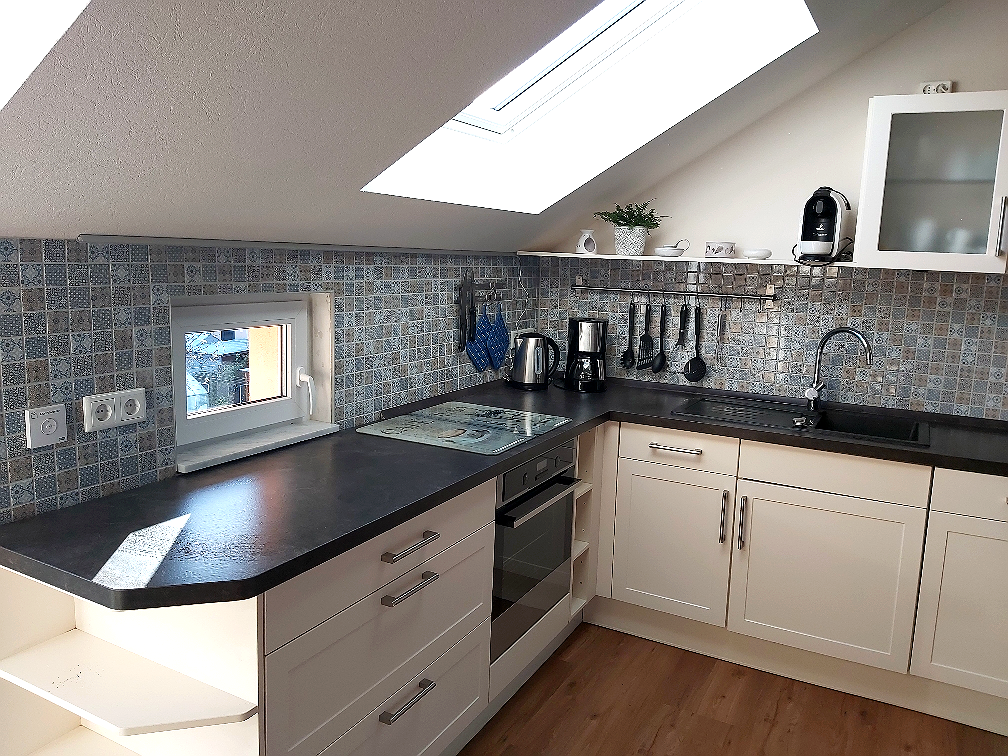 Open kitchen with island in the Wasserturm apartment